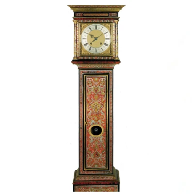 Tall ornate grandfather clock with red and gold decorative panels and a brass clock face showing Roman numerals.